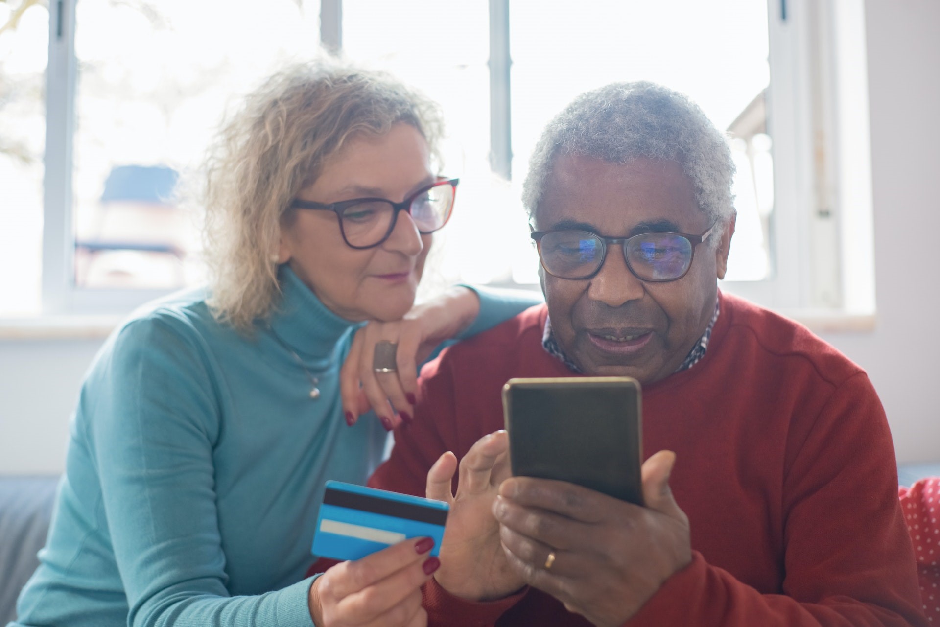 Older couple using cell phone